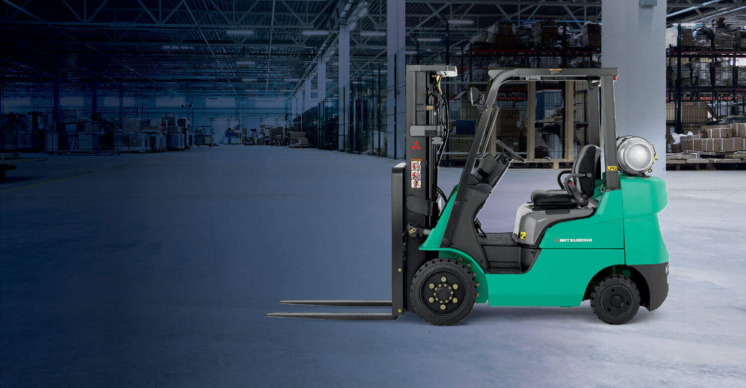 Mitsubishi IC cushion tire forklift in empty warehouse